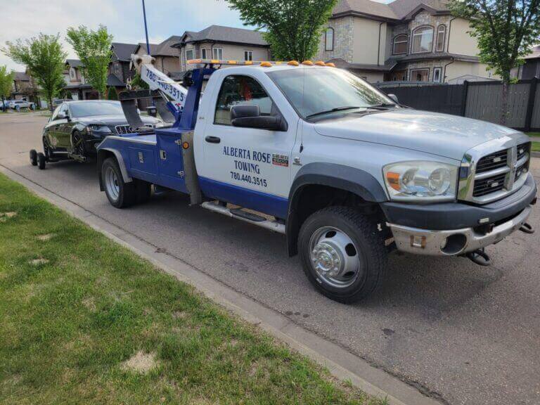 towing car by Alberta Rose Towing with the help of wheel