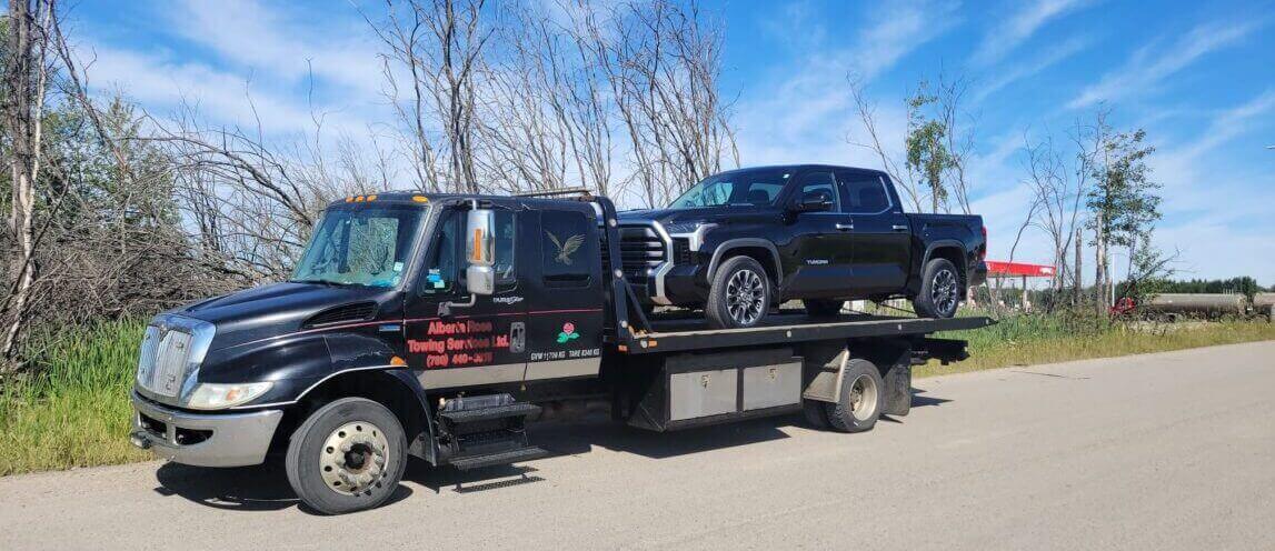 Black Car Towing by Alberta Rose towing Company